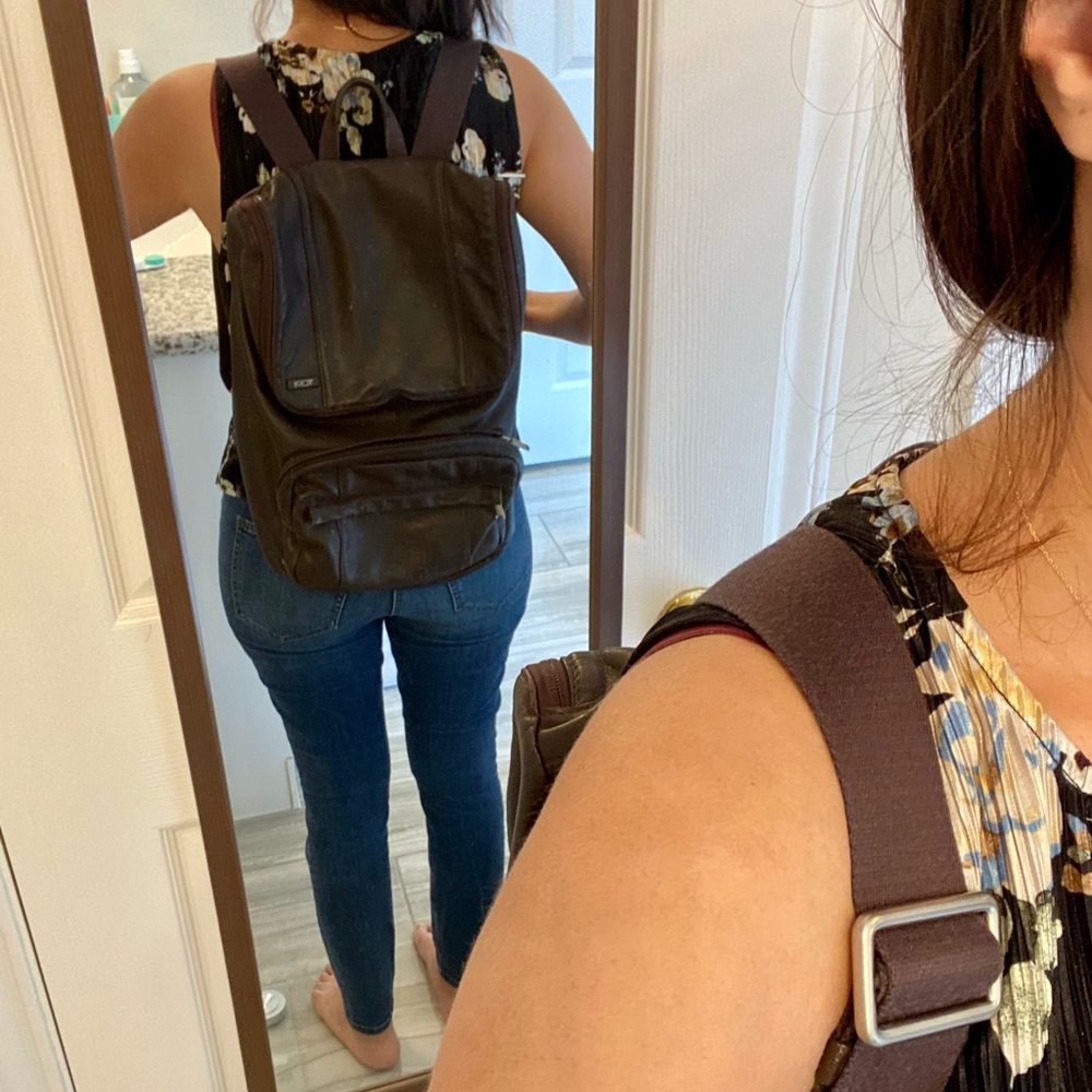Tumi unisex brown leather back pack - signs of normal wear inside.